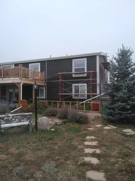 Stucco Over Siding Project Being Worked in Colorado Springs.